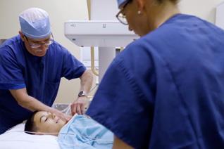 anesthesiologist working on young child